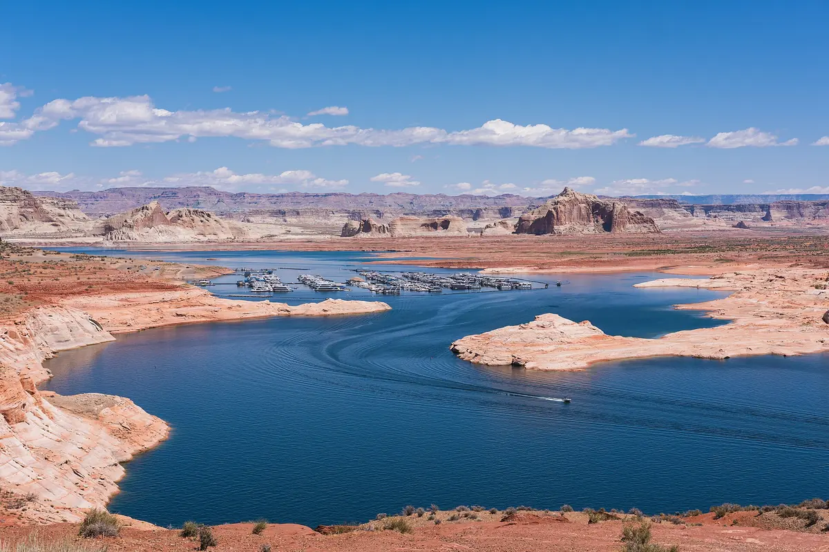 Lake Powell seen from Wahweap Overlook near Page, with blue water between red sandstone shores.